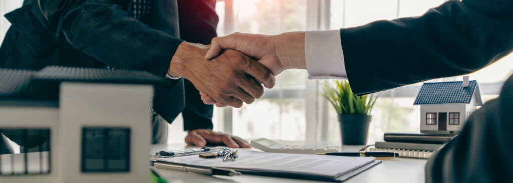 estate lawyer shaking hands with client